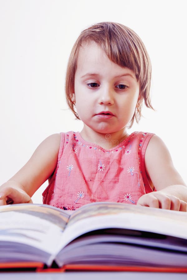 Cute little child girl is reading a book science, development, stock images Cute little child girl is reading a book science, development, stock images