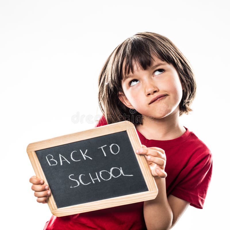 Cute little child holding a writing slate to imagine about a cool back to school, white background studio. Cute little child holding a writing slate to imagine about a cool back to school, white background studio