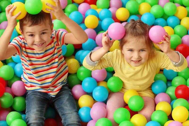 Cute little children playing in ball pit royalty free stock photography Cute little children playing in ball pit royalty free stock photography