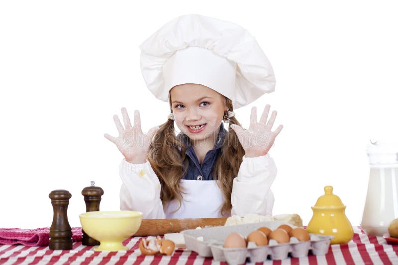 Cute little girl baking on kitchen and shows hands royalty free stock photos Cute little girl baking on kitchen and shows hands royalty free stock photos
