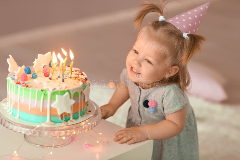 Cute Little Girl with Birthday Cake in Room Stock Photo - Image of baby ...