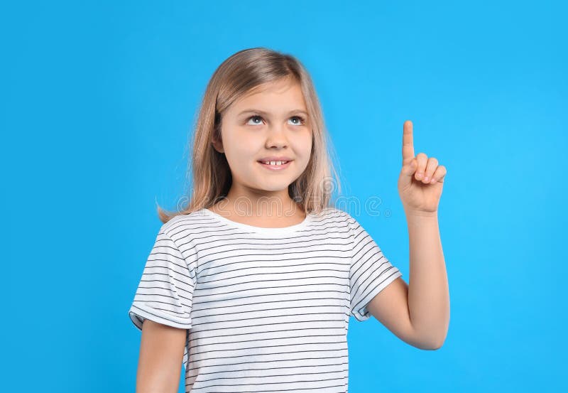 Cute Little Girl on Blue Background Stock Image - Image of face