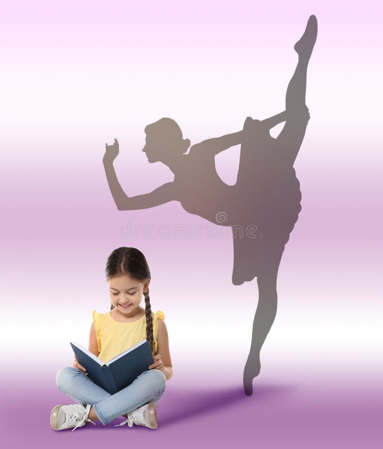 Cute little girl with book dreaming to be ballet dancer. Silhouette of woman behind kid`s back