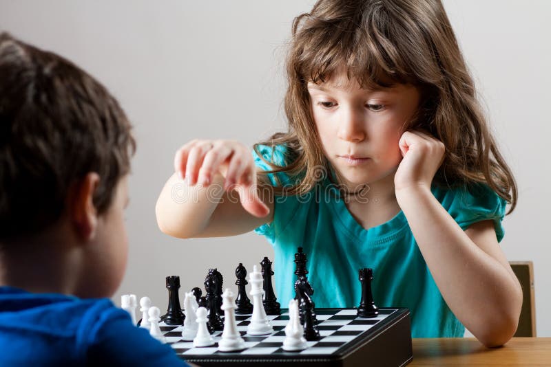 Girl and boy playing chess