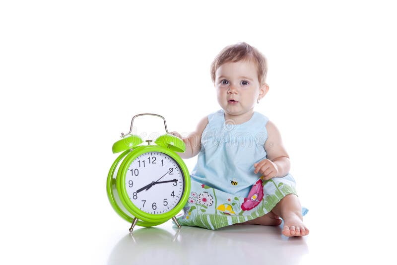 Cute little girl with the clock isolated