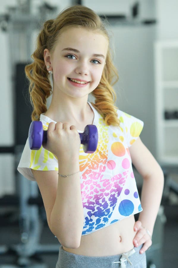 Cute Little Girl Doing Exercises Stock Photo - Image of power, fitness ...