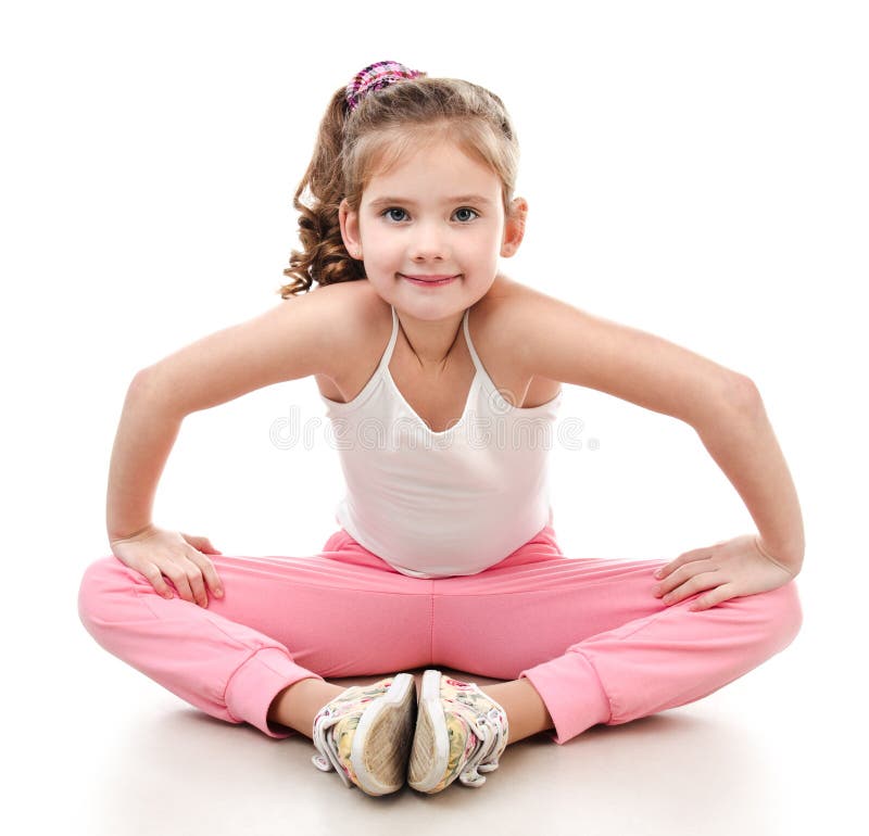 Little cute girl practicing yoga pose, isolated on white :: Stock
