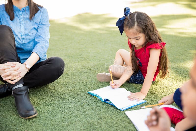 Little girl enjoying a class outdoors royalty free stock images Little girl enjoying a class outdoors royalty free stock images