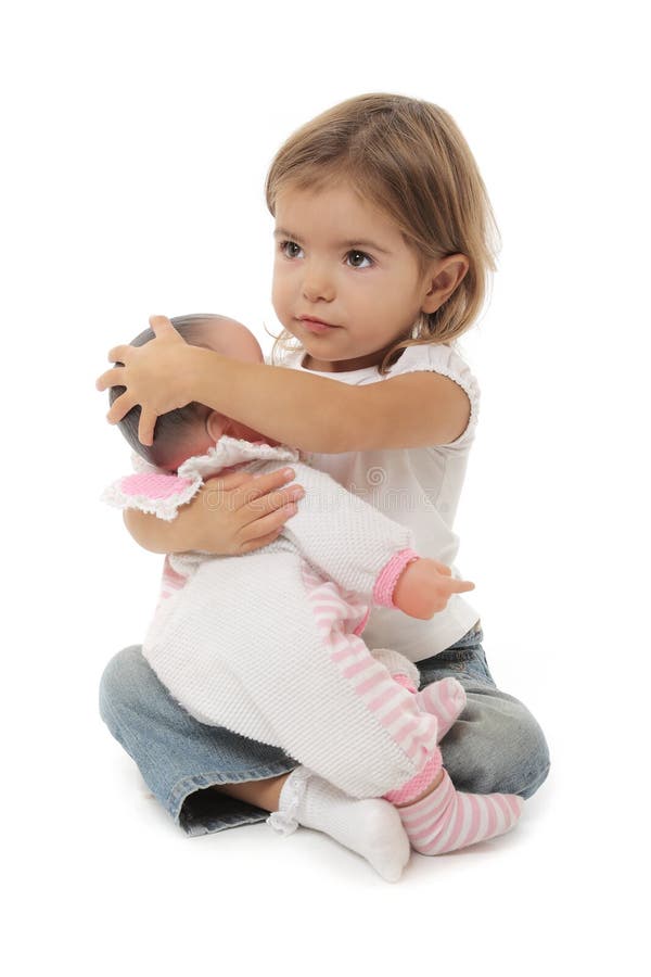 Cute little girl with doll stock photo. Image of baby 13370172
