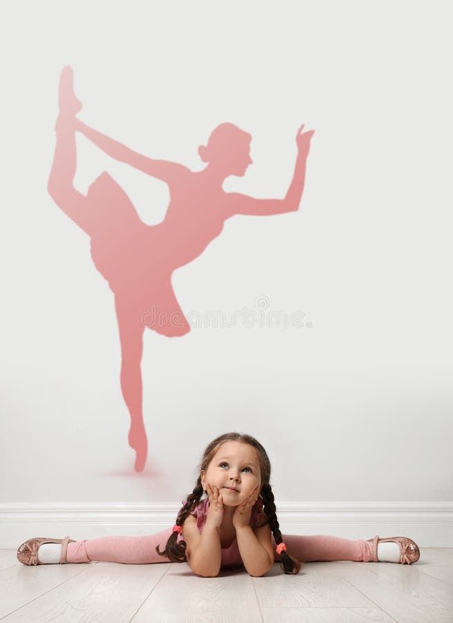 Cute little girl dreaming to be ballet dancer.