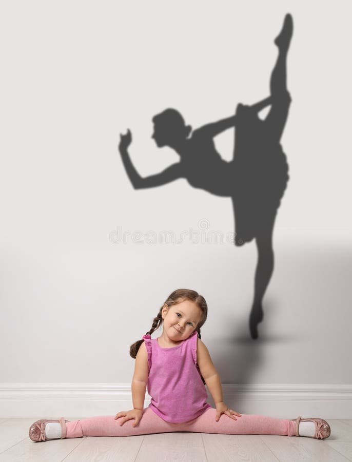 Cute little girl dreaming to be ballet dancer.