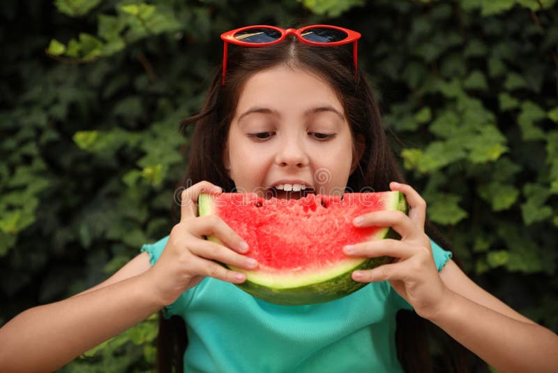 Cute Little Girl Eating Watermelon Outdoors on Sunny Day Stock Image ...