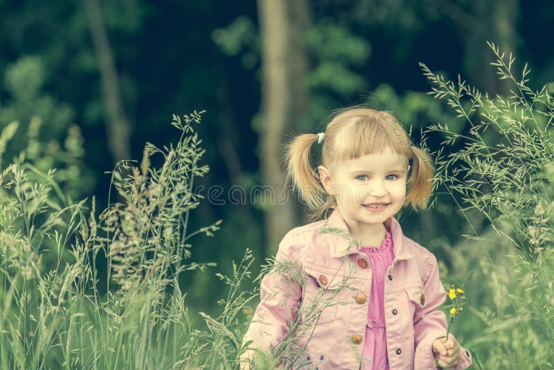 Cute little girl on the forest