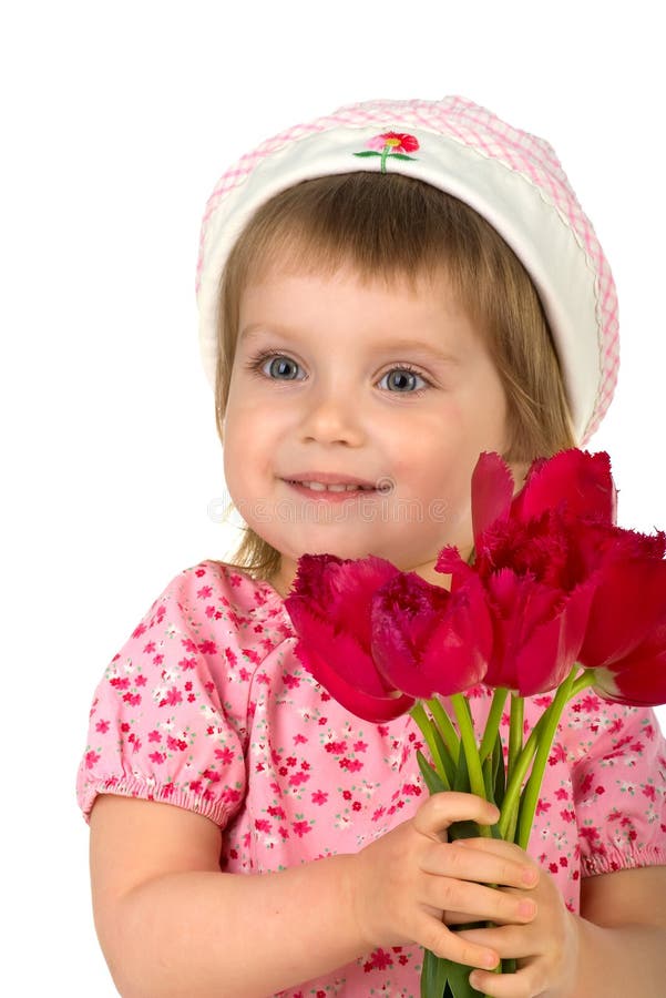 Cute little girl giving pink tulips
