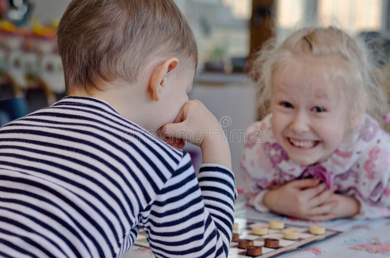 Girl playing with matches. Dangerous situation at home. A small