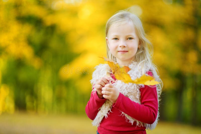 Cute Little Girl Having Fun on Beautiful Autumn Day Stock Photo - Image ...