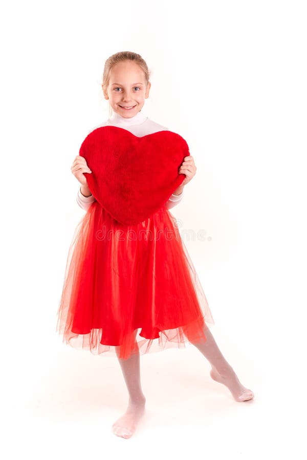 Cute little girl holding red heart isolated