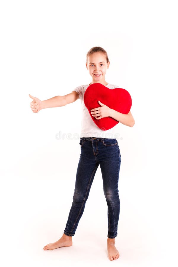 Cute little girl holding red heart isolated