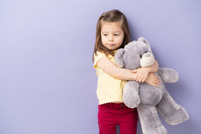 Girl Hugging Teddy Bear