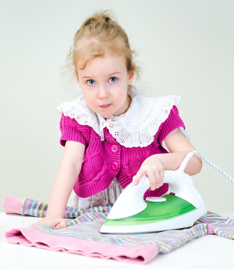 Child ironing clothes stock image. Image of steam, female 30280649
