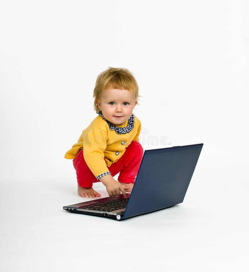 Cute little girl with laptop isolated on white