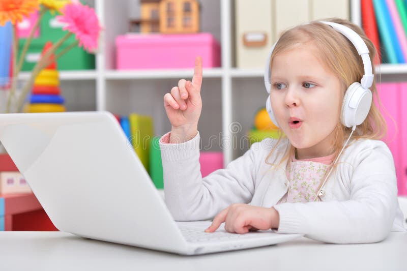 Cute little girl with laptop