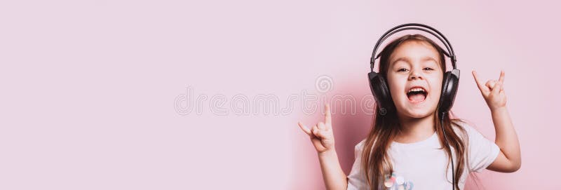 Cute little girl listening music wearing headphones stock photography Cute little girl listening music wearing headphones stock photography