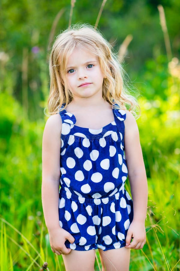 Cute Little Girl With Long Blond Curly Hair Outdoor P