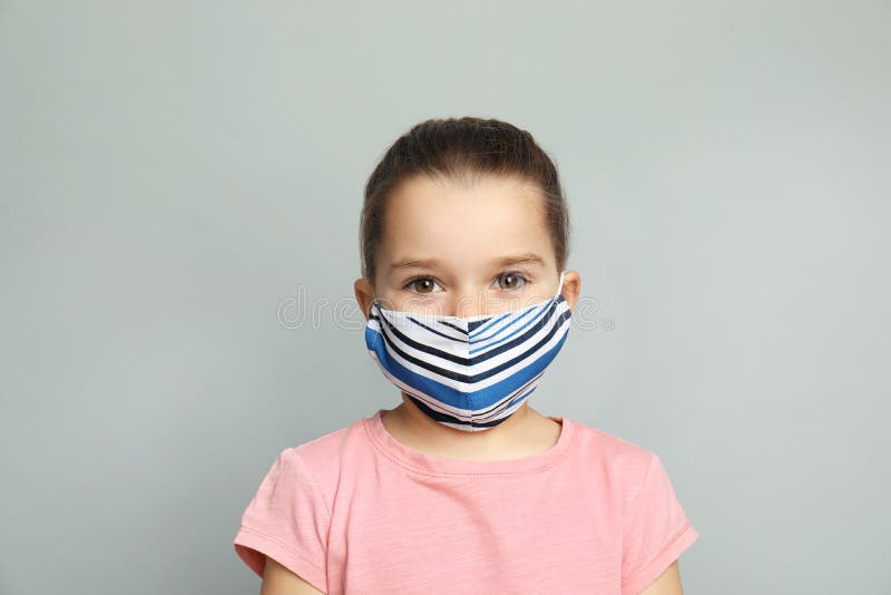 Cute Little Girl in Protective Mask on Grey Background Stock Image
