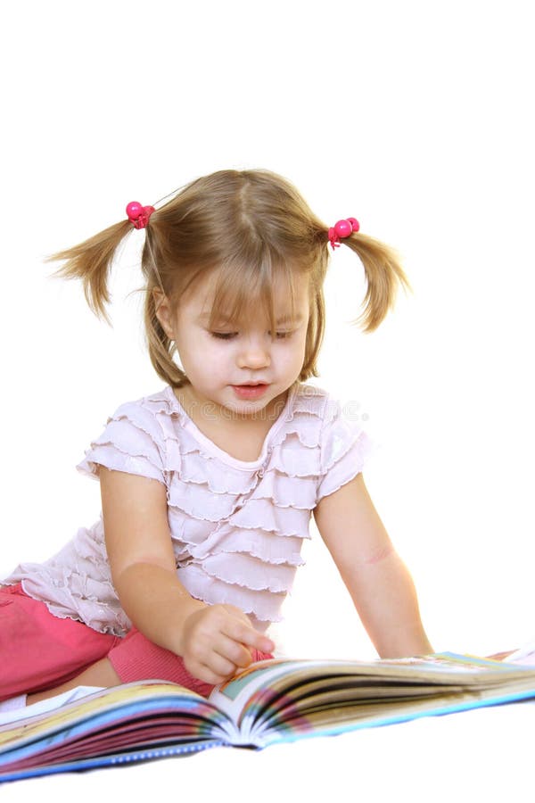 Cute little girl reading book