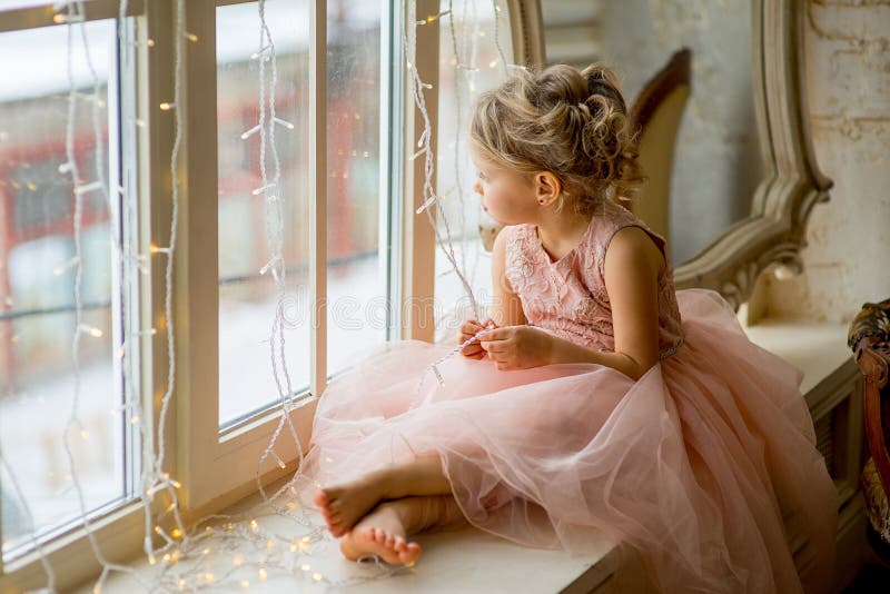 Cute Little Girl Sitting by the Window Stock Image - Image of december ...