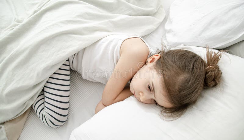 A Cute Little Girl is Sleeping in a White Bed Stock Photo - Image of ...