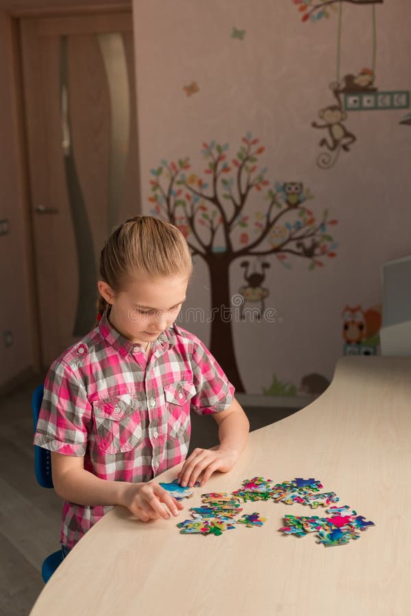 Cute little girl solving puzzle together royalty free stock image Cute little girl solving puzzle together royalty free stock image
