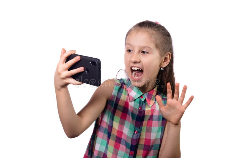 Cute little girl taking a selfie on her phone