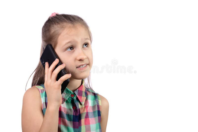 Cute little girl is talking on a cell phone