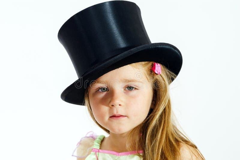 Cute little girl in top hat royalty free stock photography