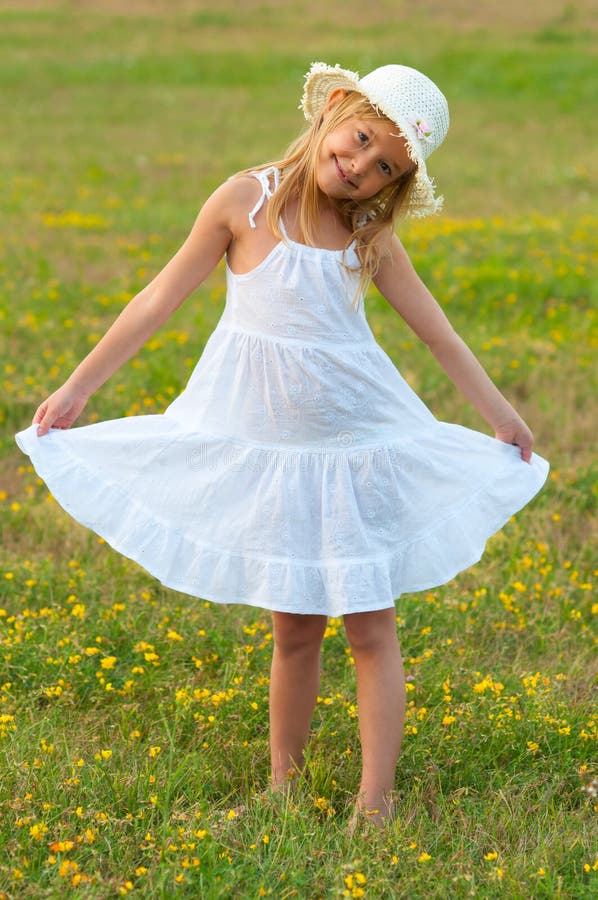 Cute Little Girl in White Dress and Hat ...