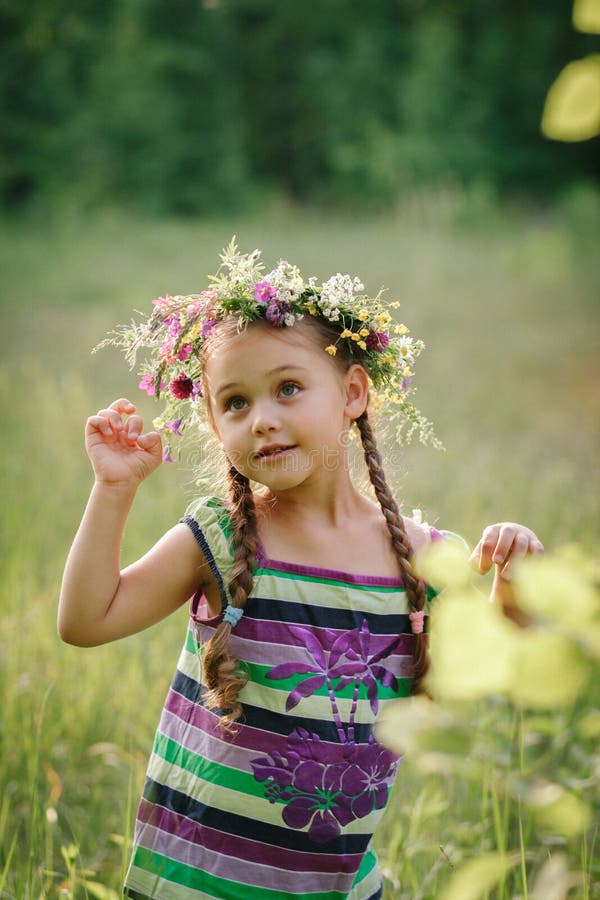 Little Girl in a Wreath of Wild Flowers in Summer Stock Photo - Image ...