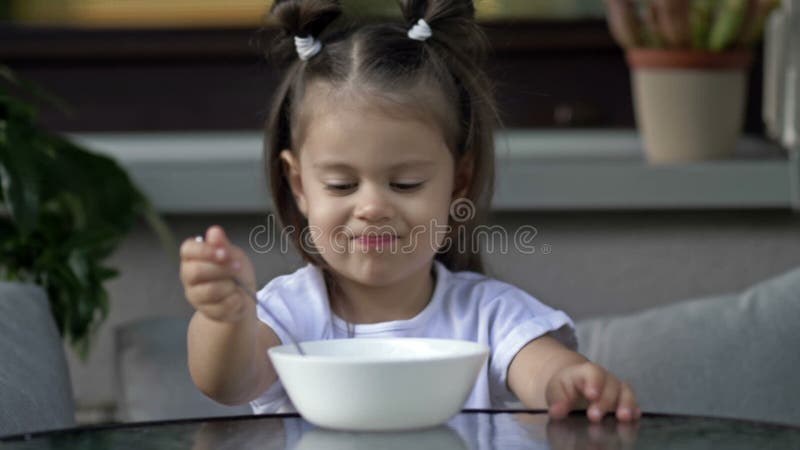 Cute Little Girl 2 Years Old Does Not Want To Eat Porridge. Baby Food