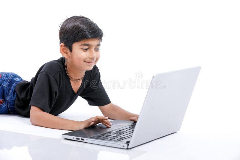 Cute Little Indian/Asian Boy Studying or Playing Game with Laptop Computer  Stock Photo - Image of looking, elementary: 150322928