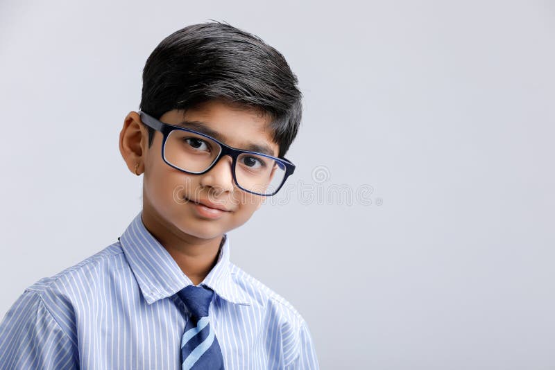 Smiling Indian Primary School Kid Boy Student Standing In Library