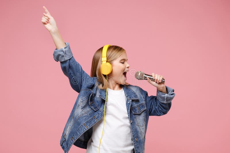 Cute little kid girl 12-13 years old isolated on pastel pink background. Childhood lifestyle concept. Mock up copy space