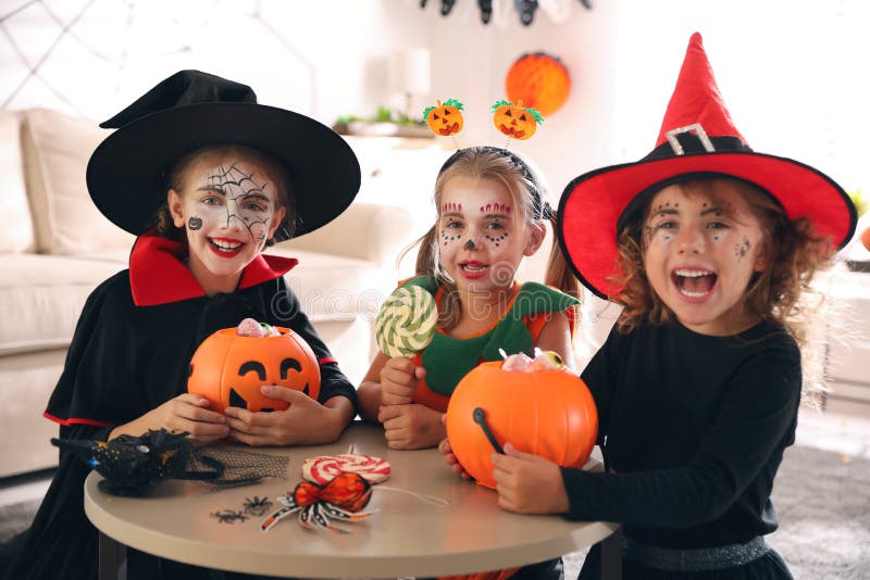 Cute Little Kids with Pumpkin Buckets Wearing Halloween Costumes at ...