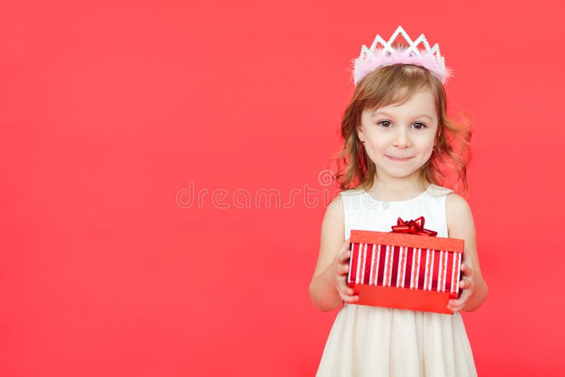 Cute little preschooler girl christmas portrait, isolated on red royalty free stock photography Cute little preschooler girl christmas portrait, isolated on red royalty free stock photography