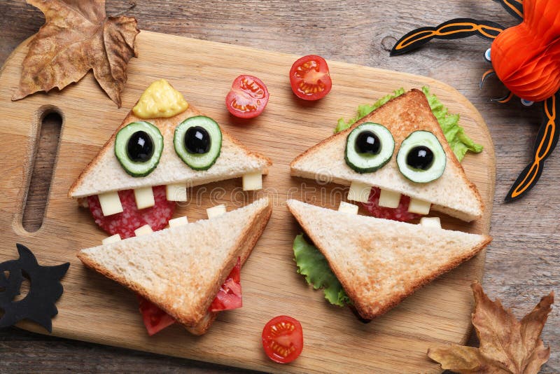 Cute Monster Sandwiches Served on Wooden Table, Flat Lay. Halloween ...