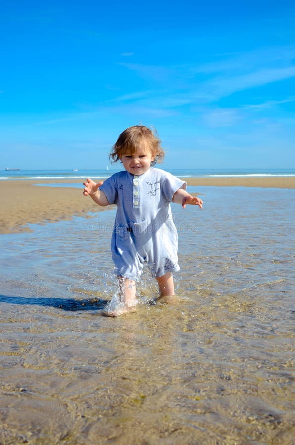 Cute Portrait of a Little Girl Discovering the Beach and the Sea Stock ...