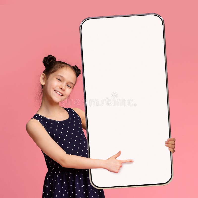 Cute Preteen Girl Pointing At Big Smartphone With Blank White Screen
