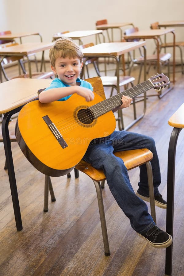 Cute Pupil Playing Guitar in Classroom Stock Photo Image of learning, learn 43660018