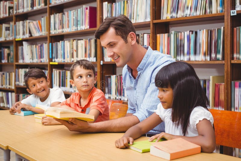 Cute Pupils and Teacher Reading in Library Stock Image Image of
