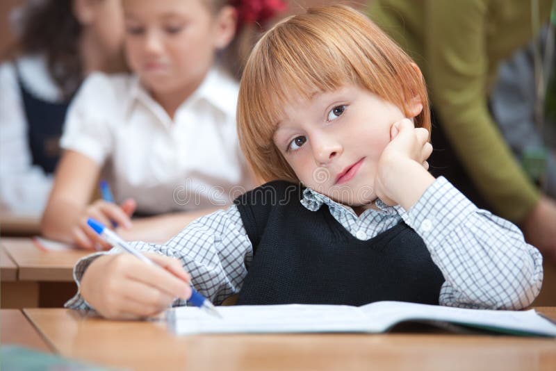 Cute schoolboy in classroom royalty free stock images Cute schoolboy in classroom royalty free stock images